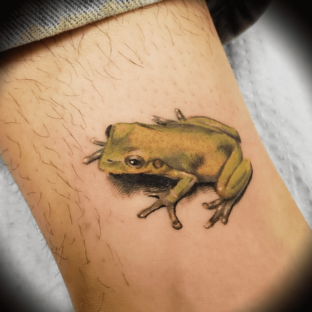 Color realism tattoo of a Coqui