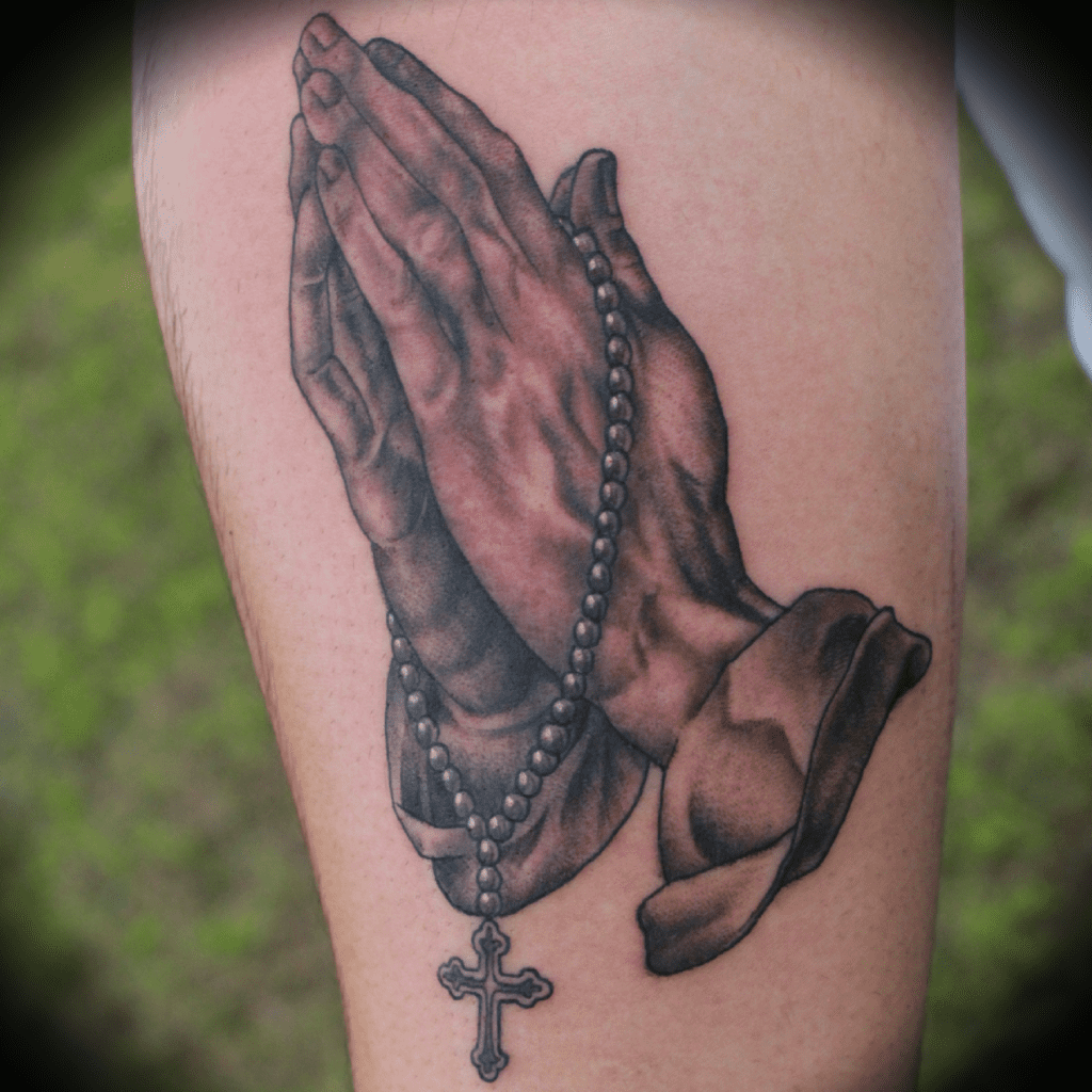 Praying hands tattoo